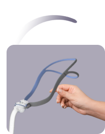 Female hand holding a Nasal CPAP Mask