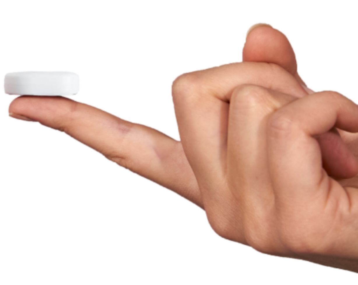 A finger holding the NightOwl® Home Sleep Test