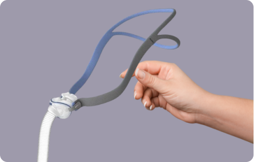 Female hand holding a Nasal CPAP Mask